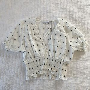 White polka dot top